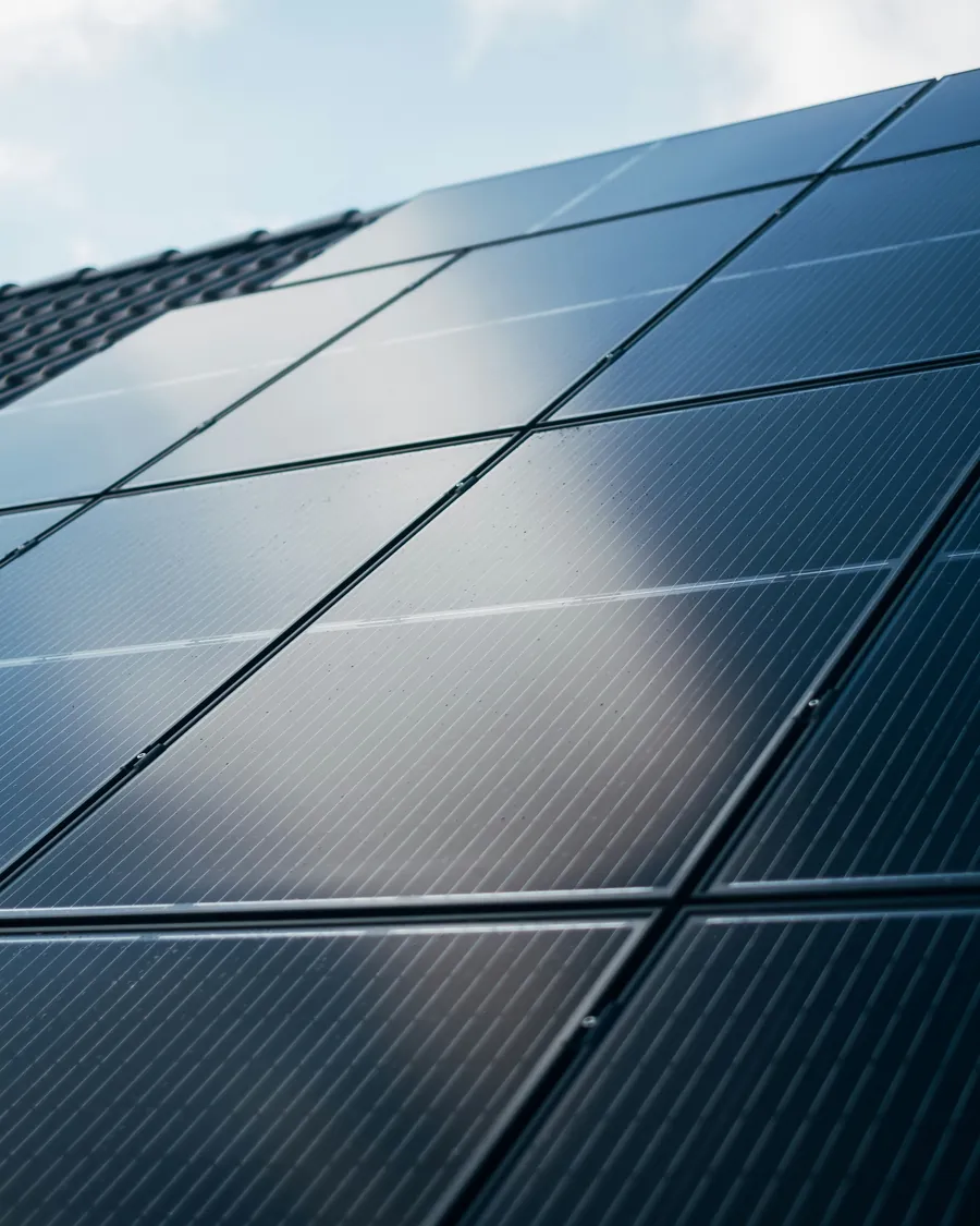 Solar panels on a roof under a clear sky